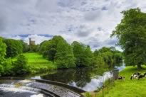 Hornby river Wenning Weir with Hornby Castle in background